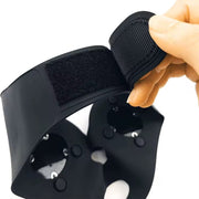 Luxury black facelift E- mask worn by woman for jawline and cheek lift using GYM IN A BOX® patented ToneUp15® StimFit Beauty Technology. Metallic pink, gold, and black branding. Hands-free wearable for sculpting face in 15 minutes Velcro closure
