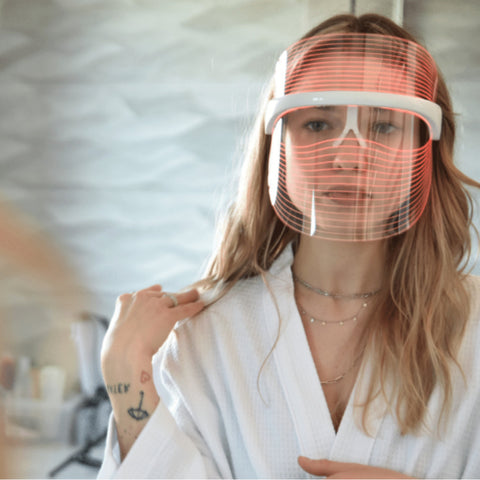 Magic Glow 7in1 LED BeautyShield 
Woman enjoying a hands-free LED light therapy session with the Magic Glow 7-in-1 BeautyShield mask by GYM IN A BOX®; luxury skin treatment at home and on the go .