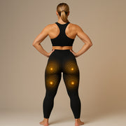 Back view of a woman wearing GYM IN A BOX® StimFit E-Pants with visible gold activation zones on the glutes and under-glute areas.