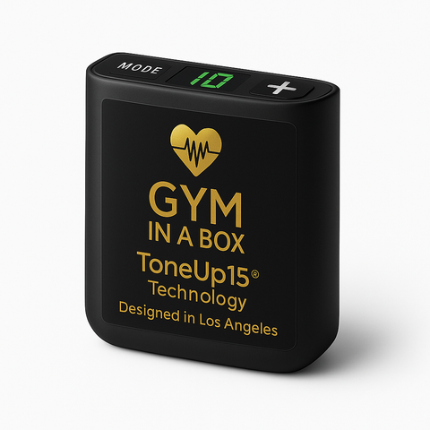 Black electronic device with 'GYM IN A BOX' branding on a white background Close-up studio photo of the GYM IN A BOX® ToneUp15® controller unit in matte black with gold luxury logo and display buttons, designed in Los Angeles.