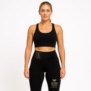 Woman wearing a black sports bra and leggings with 'Gym in a Box' branding, • 6 Intelligent Toning Modes