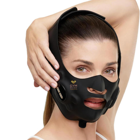 Luxury black facelift mask worn by woman for jawline and cheek lift using GYM IN A BOX® patented ToneUp15® StimFit Beauty Technology. Hands-free wearable for sculpting face in 15 minutes.”