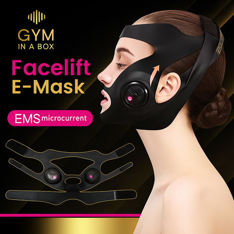 Luxury black facelift mask worn by woman for jawline and cheek lift using GYM IN A BOX® patented ToneUp15® StimFit Beauty Technology. Metallic pink, gold, and black branding. Hands-free wearable for sculpting face in 15 minutes.