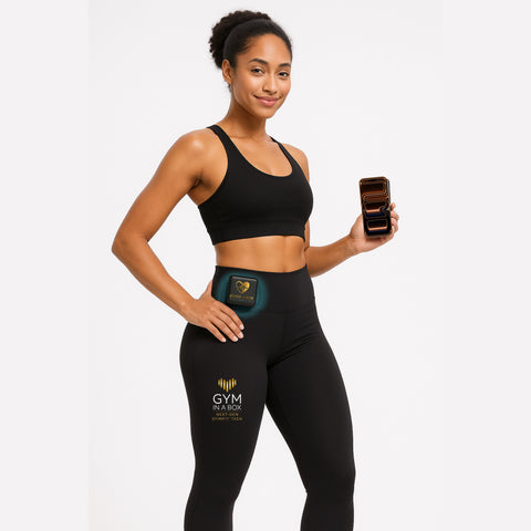 Fit woman wearing GYM IN A BOX® StimFit E-Pants featuring the golden ToneUp15® power host device on waistband — luxury smart fitness leggings designed to enhance performance, promote circulation, and support muscle toning through NextGen StimFit Technology.